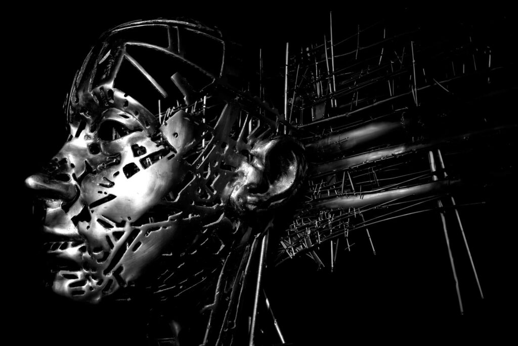 The selection of this machine-like human-faced artwork is meant to give the idea of development partners, because one person can not do it alone, and there are many moving parts.