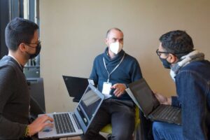 Group members working at the PKP Sprint Bogotá 2022