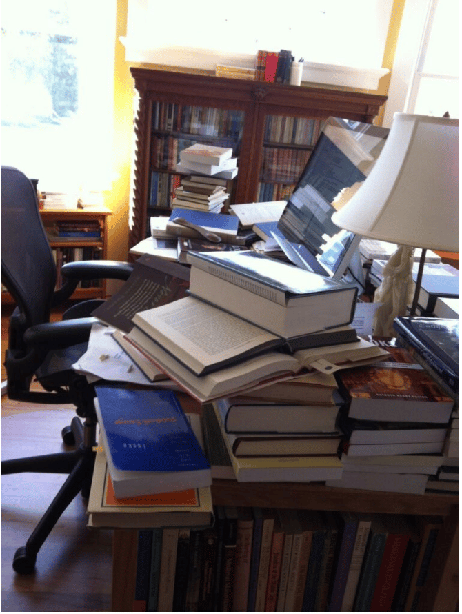 This was John Willinsky's desk when he was doing research for one of his books. The image is meant to represent how PKPers have made open access and the associated research and infrastructure a major part of their lives.